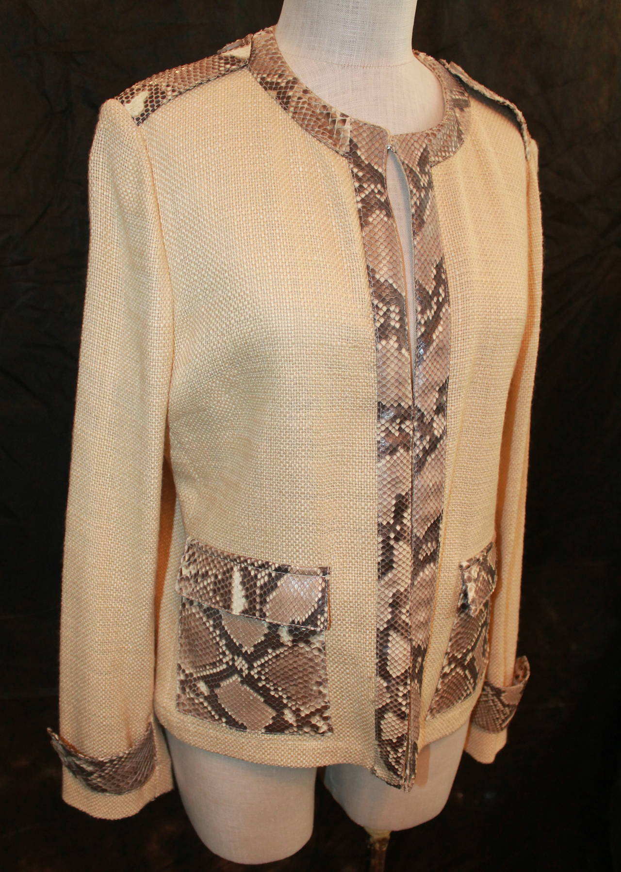 Dolce & Gabbana Tan Linen Jacket with Python Accents. This jacket is in very good condition. It does not have buttons but does have three hooks. It is an Italian size 46.

Measurements:
Shoulder to Shoulder- 16