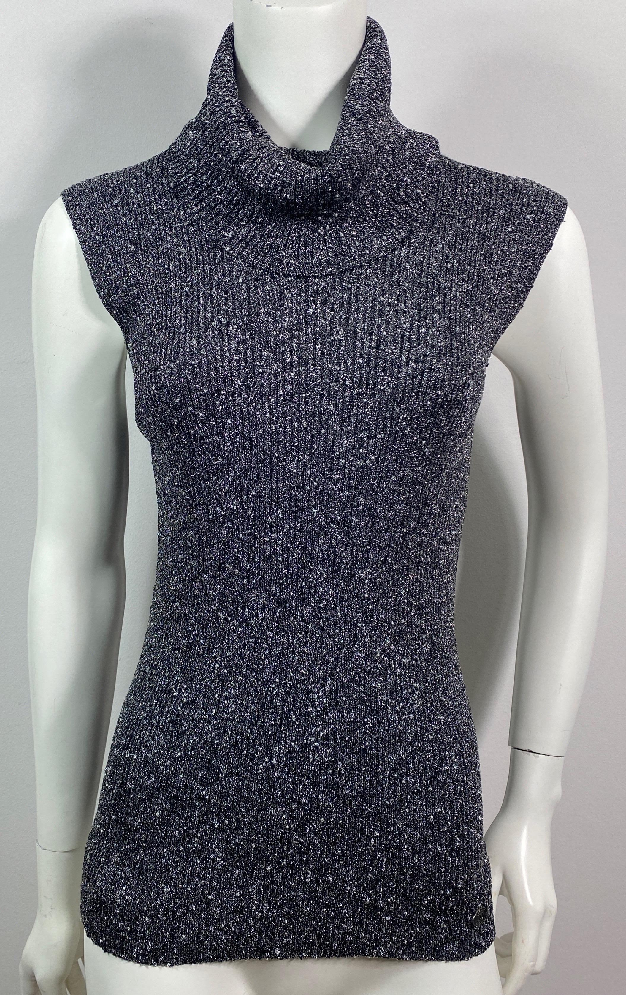 Chanel Runway Fall 2005 grey, black and silver metallic ribbed knit sleeveless turtleneck top - size 40
This runway piece was part of look 13 in the Fall 2005 fashion show. The fabric of this top is a viscose and metal knit with grey, black and