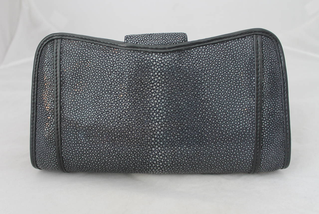 Eileen Kramer Grey & Black Sting Ray Clutch. This clutch is in impeccable and is a one of a kind piece. 

Measurements:
Length- 5.25"
Width- 9.5"
Depth- 2.25"
