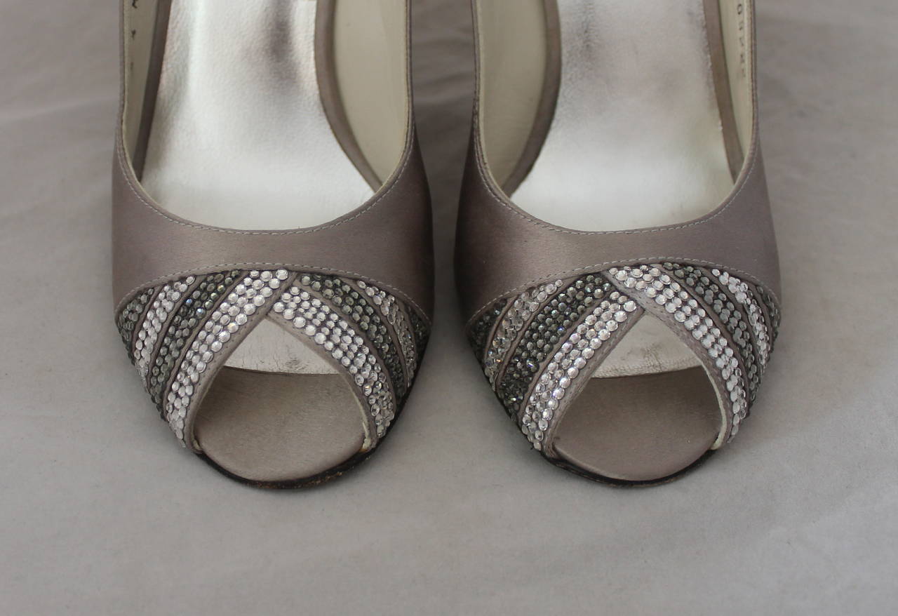 Stuart Weitzman Silver Slingbacks with Swarovski Crystals - rt. $1100 - 6.5. These shoes are in very good condition with minor wear on the bottom.
