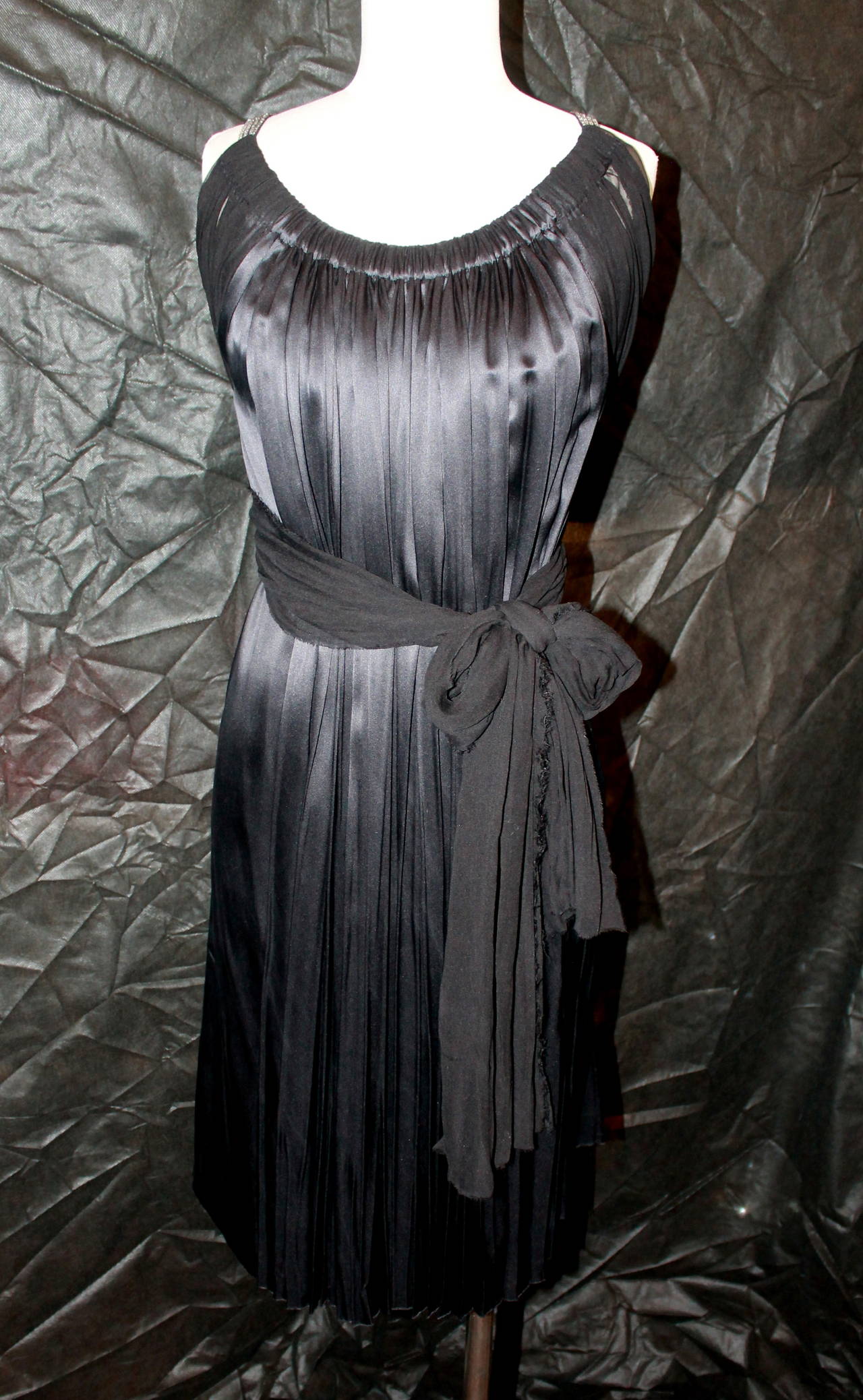 Lanvin Black Silk Chiffon Dress with Rhinestone Straps & Long Sashes. This dress is in very good condition. The sizing on this dress is flexible fitting between a small and large because of its style. 

Measurements:
Sash Length- 57