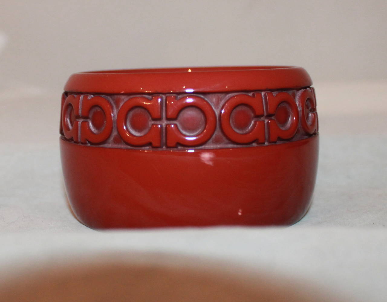 Salvatore Ferragamo Burnt Red Resin Cuff with Logo. This cuff is in excellent condition.

Length- 8