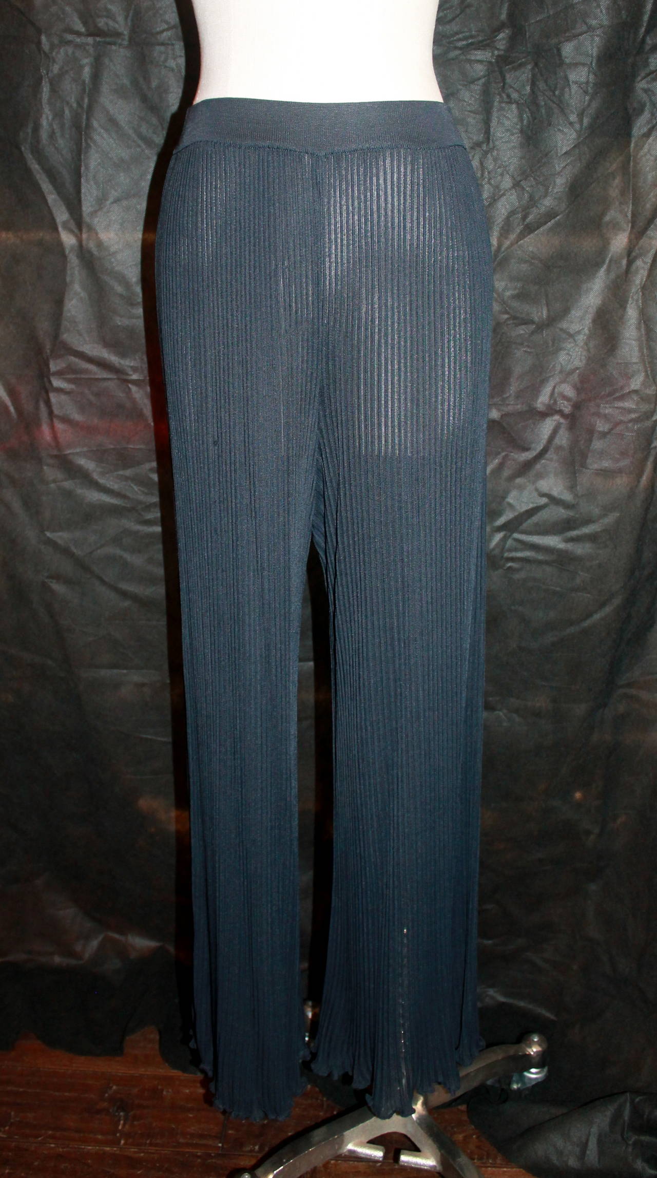 Chanel 1980's Vintage Black Pleated Palazzo Pants -  38. These pants are in good vintage condition with wear consistent with its age. There is some pulling in the front that is visible. The material is stretchy. 

Measurements:
Waist- 26