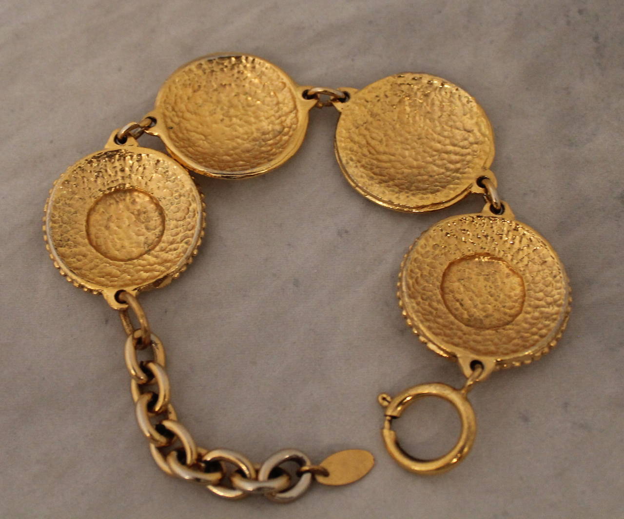 Chanel 1995 Vintage Goldtone Coin Bracelet. This bracelet is in very good vintage condition.

Measurements:
Length- 7.25-9.25