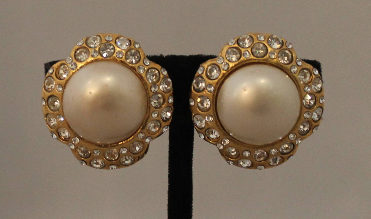Chanel 1970's Vintage Goldtone & Rhinestone Pearl Clip-On Earrings. These earrings are in very good vintage condition with wear consistent with its age. Some of the gold paint on the back of the earrings is starting to