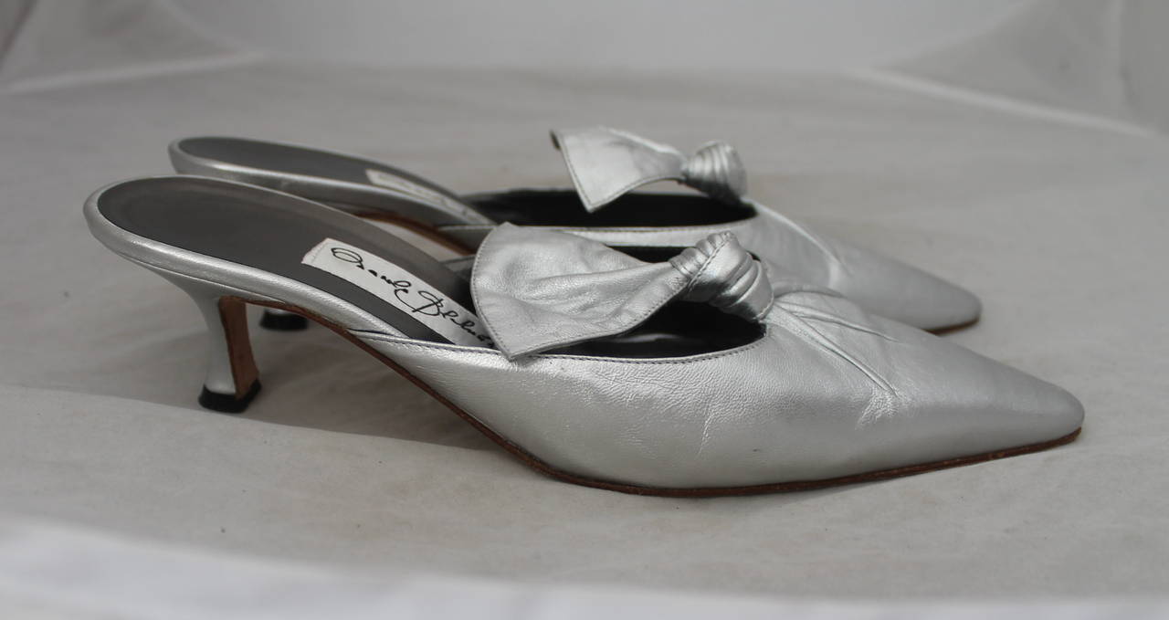 Manolo Blahnik Special Edition Metallic Silver Kitten Heel - 37.5. These shoes are in good condition and have some wear on the sole.