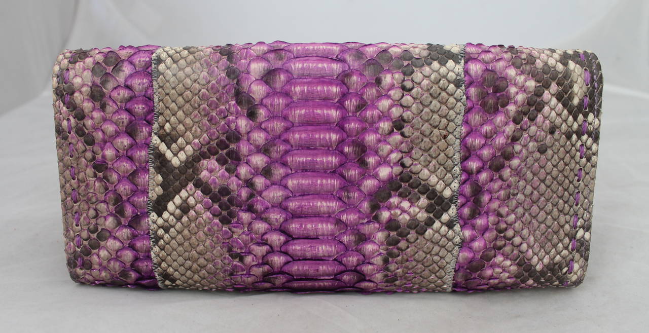Carlos Falchi Violet Python Clutch & Shoulder Bag. This bag is in excellent condition and has a silver chain strap. It also has a floral lining. 

Measurements:
Length- 5