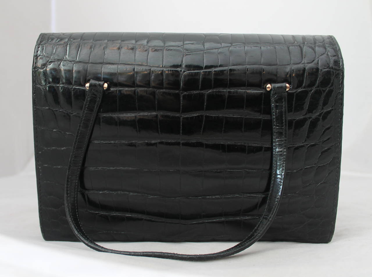 1950's Vintage Cilli Black Crocodile Accordian Handbag. This bag is in excellent vintage condition with very minor wear to the outside but some wear to the inside. 

Measurements:
Length- 7.5
