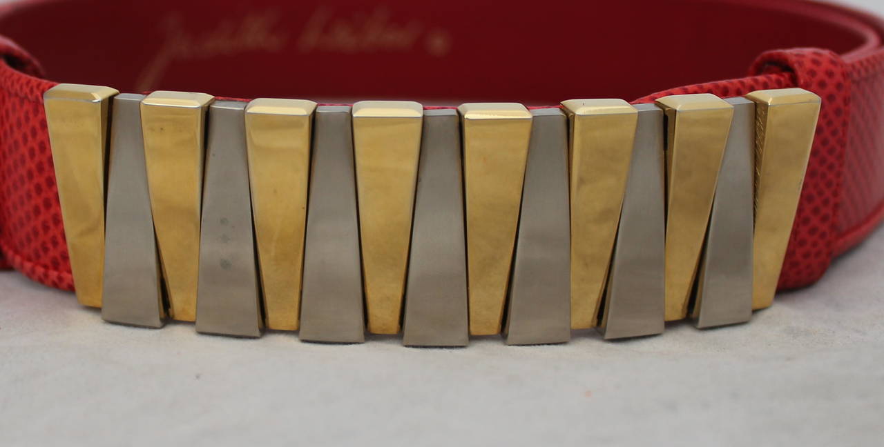 Juidth Leiber 1980s Red Lizard Belt with Gold & Silver Geometric Buckle. This belt is in excellent condition with minor wear. 

Width: 1.25