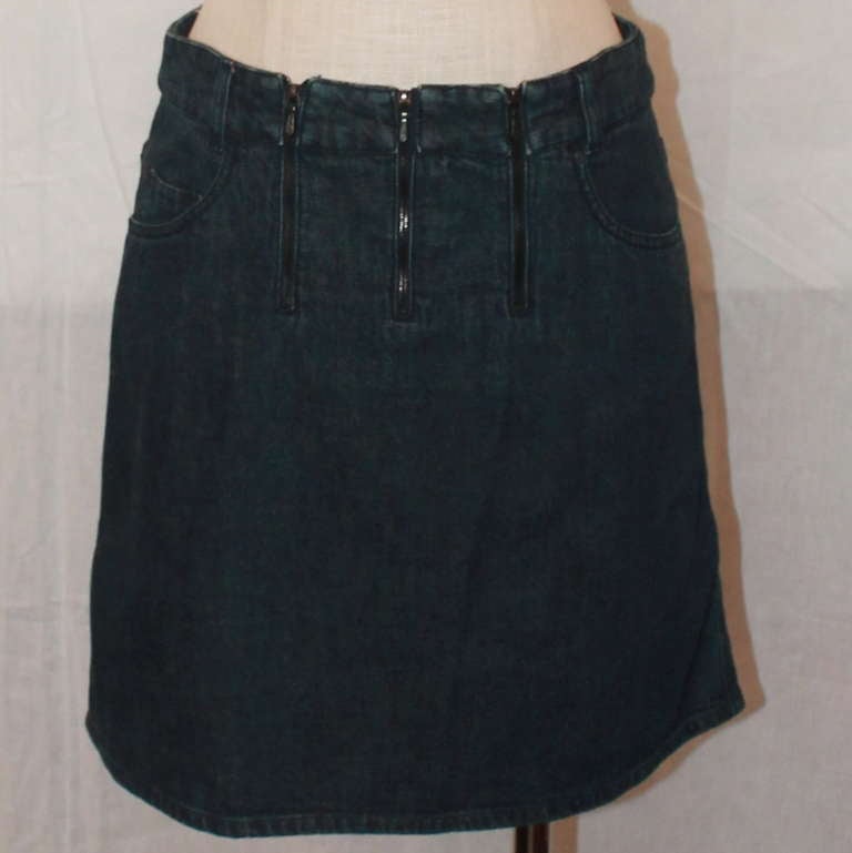 Chanel Denim Zippered Short Skirt. Three zippers are in the front and skirt is in very good condition. Size 38. 
Measurements:
Waist- 30