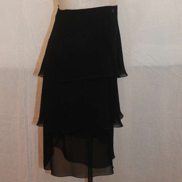 Chanel Black Tiered Silk Chiffon Skirt with zipper on the side. This skirt is in excellent condition. Size 34.
Measurements:
Waist- 26