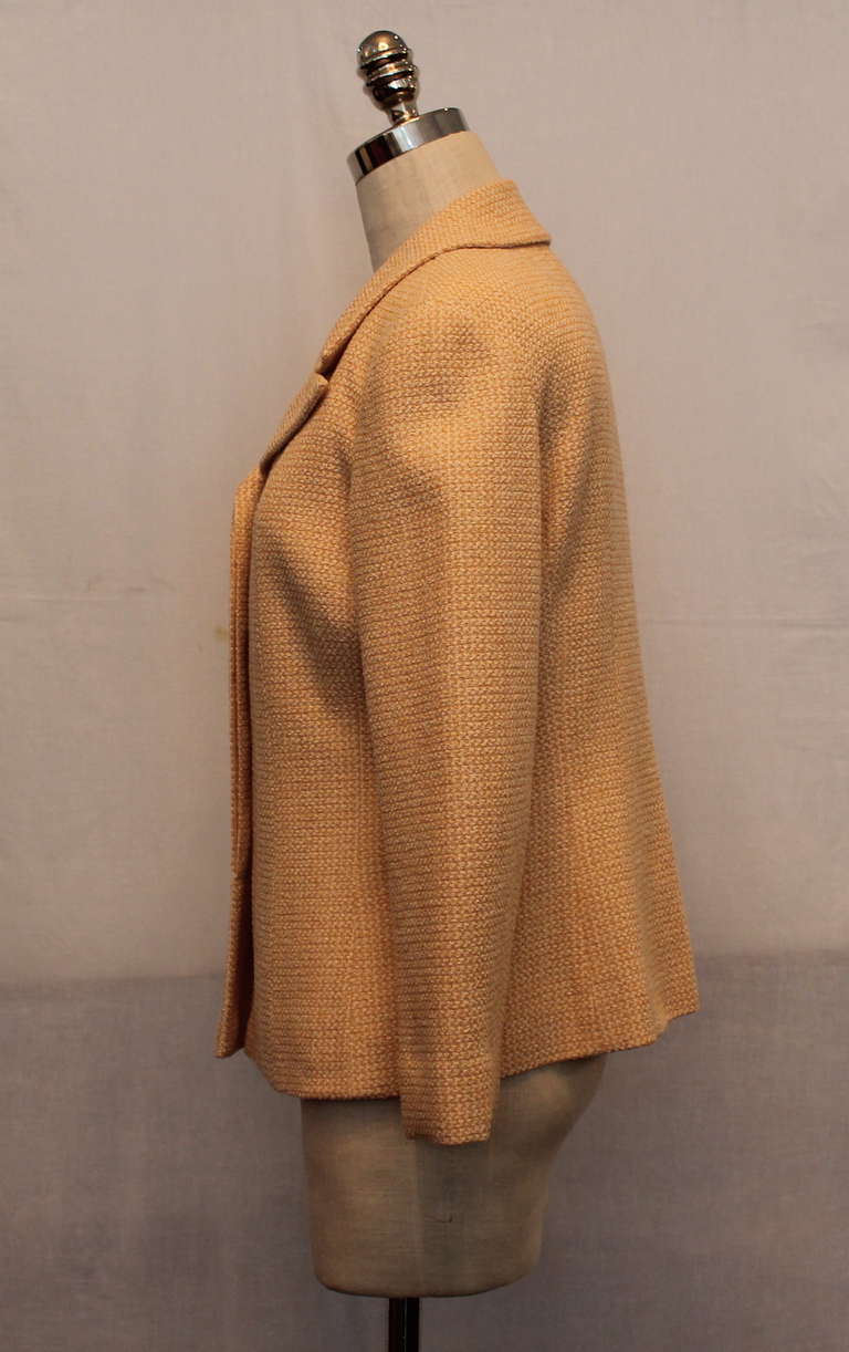 Chanel single breasted peach & cream tweed jacket with four hidden buttons. Jacket is in impeccable condition. Circa 2000s. Size 38.
Measurements:
Bust- 37