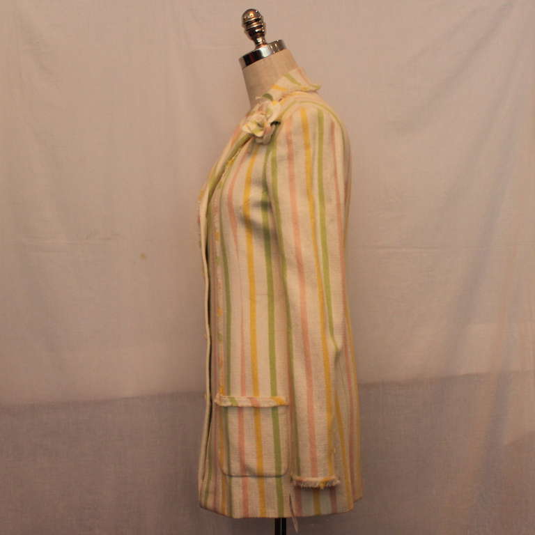 Chanel Pastel Striped Cotton Jacket w/ camelia brooch -  Circa 04C - Sz 40  This jacket is single breasted, 4 button front, fringe trim , fabric camellia brooch. The jacket is in very good condition.
Measurements:
Bust 35