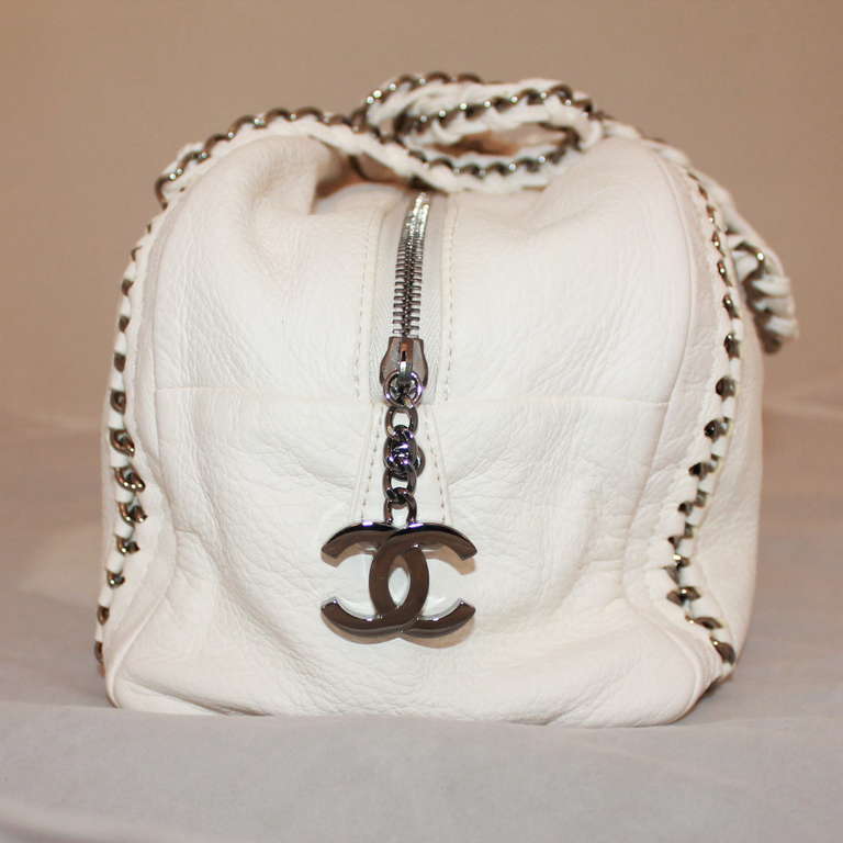 Chanel White Calfskin Luxury Ligne Bowler Handbag - SHW - 2006  This bag is in excellent condition. Comes with Card and Duster. 
Measurements:
Width 13