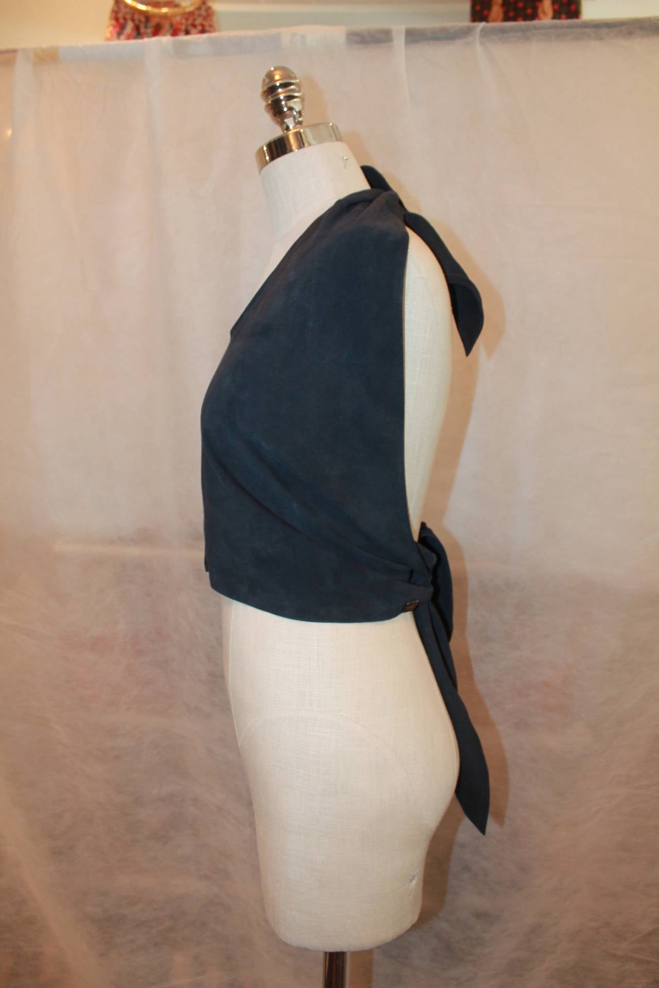 Chanel Navy Suede Halter Top - 38 - 2002. This top is in good condition with light wear to the suede. It can fit a variety of sizes because it has no set closures. 