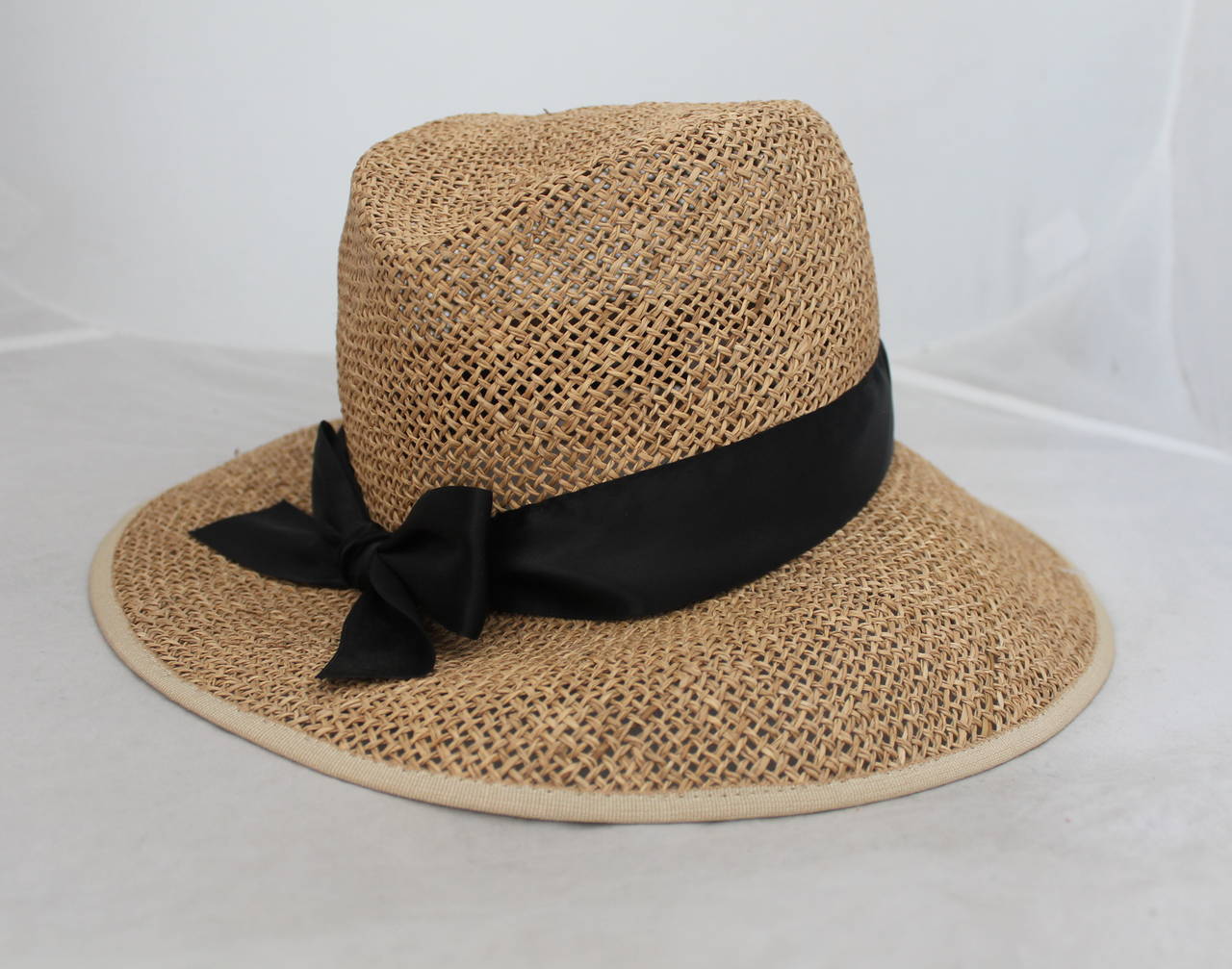 Sonia Rykiel beige straw hat with black ribbon detail. Hat is in excellent condition. Brim on hat is 3.5