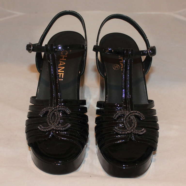 Chanel Black Patent Leather Platform Heels - 36.5. Heels have a T-strap with 