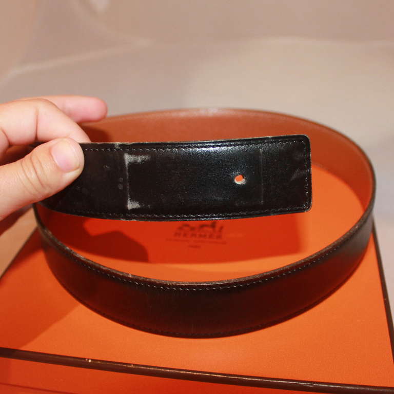 Hermes Black and Gold Togo & Box Calf Leather Belt - 76. Circa 1998. This belt is in very good condition with minor wear near the buckle area and holes. 
Measurements:
Width- 1.25