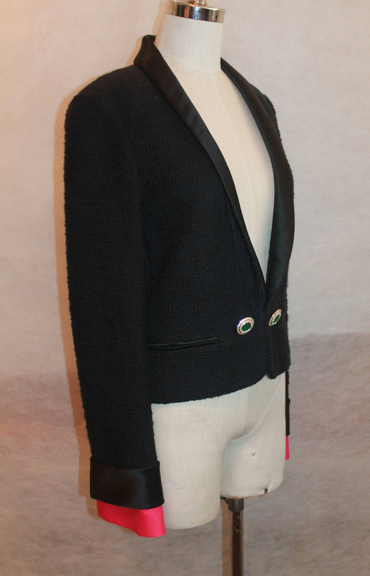 Chanel Black tuxedo style jacket w/ pink removable cuffs-40 
2 beautiful front gripoix buttons w/ pearls and rhinestones, 2 pockets
Measurements:
Bust 36"
Shoulder to shoulder 15.5"
Waist 33"
Sleeve length 24" (not