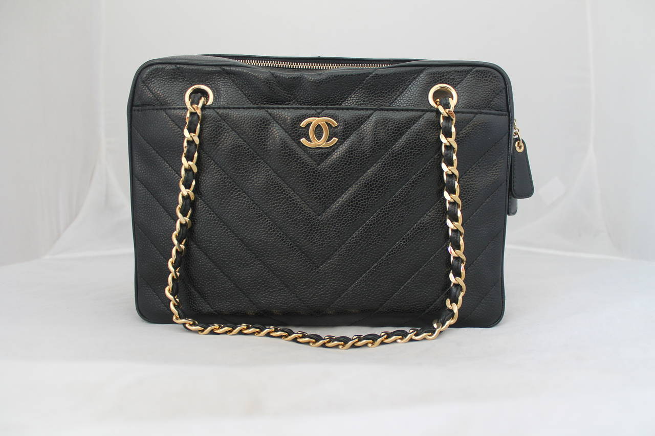 Chanel 2002 Black Caviar Chevron Quilted Camera Case Bag, This bag is in very good condition and comes with an authenticity card and duster. The hardware is in excellent condition, the only issue this bag has is that there is a slight indent in the