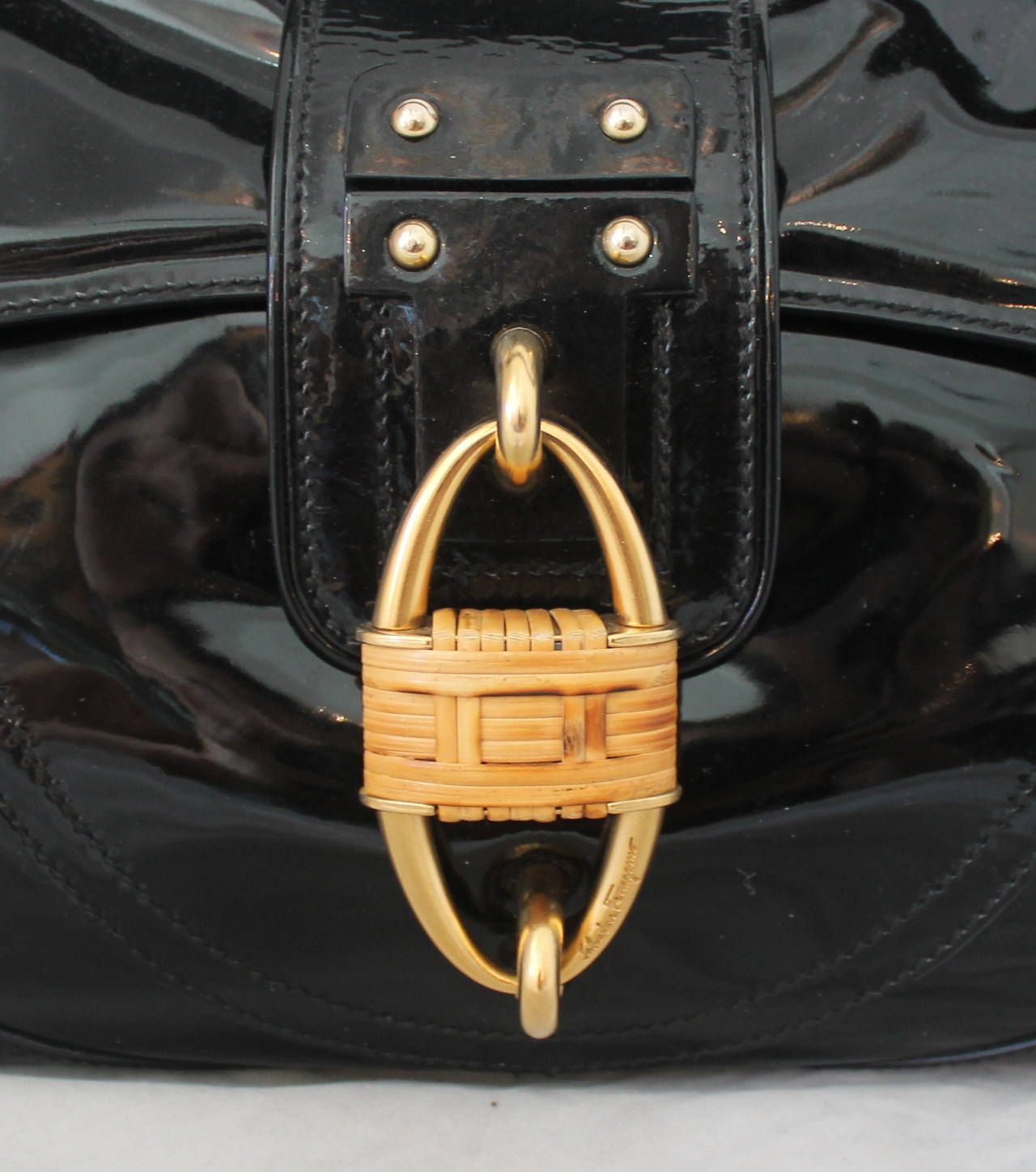 Salvatore Ferragamo Black Patent Leather Shoulder Bag with Gold Hardware and Bamboo Motif Clasp. This Bag is in Excellent Condition.

Measurements:
Height: 8 