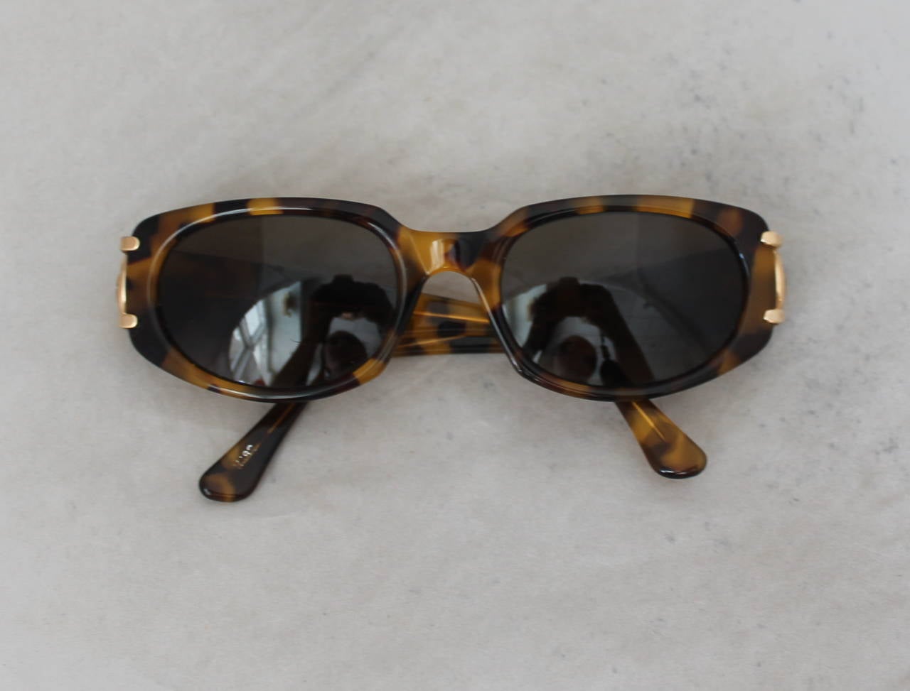 Jean Patou 1980's Vintage Tortoise Sunglasses. These sunglasses are in very good vintage condition with minor wear. The only issue this piece has is that the legs are a little loose and need to be tightened (image 5). 

Frame to Frame Length-