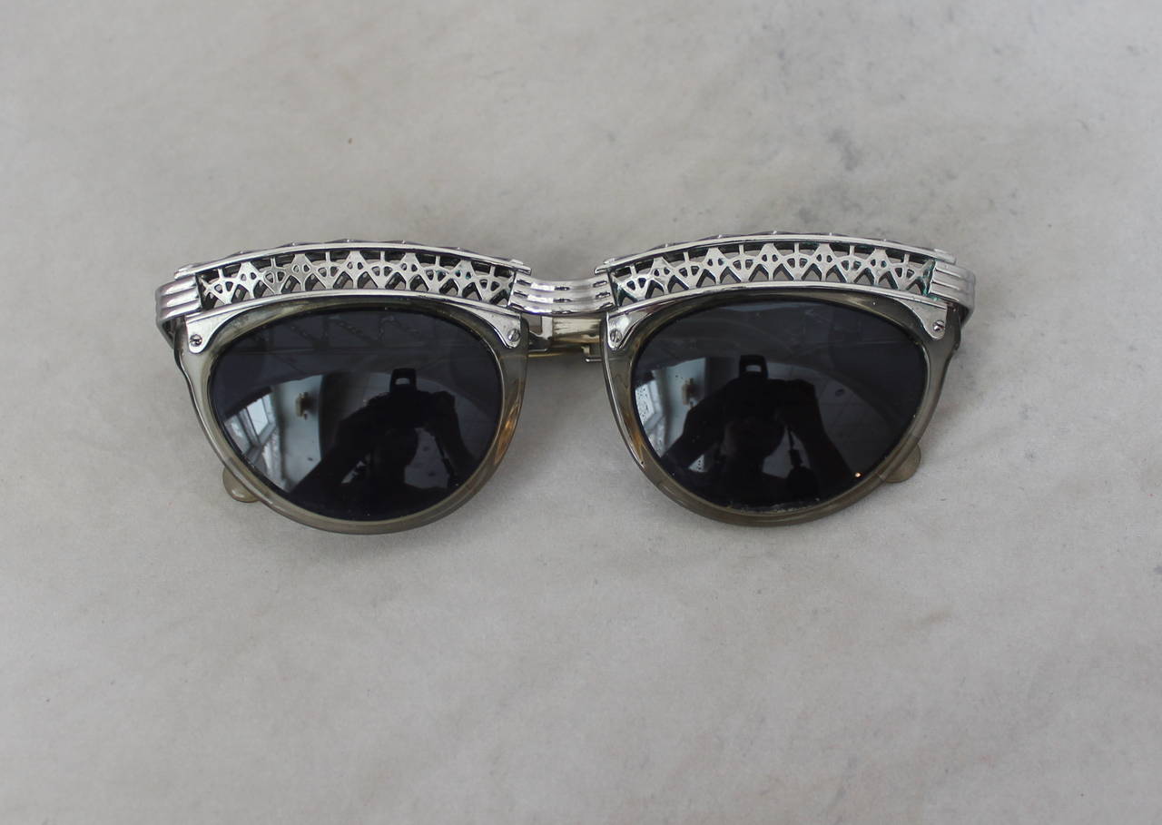 Jean Paul Gaultier 1980's Vintage Eiffel Tower Sunglasses. These glasses are in very good vintage condition with minor issues due to age and come with a case. The inside has minor green spotting due to age on the inside, however it is not apparent