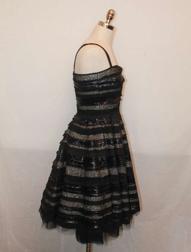 Fendi black silk mix layered sequin & lace striped dress. The dress is strapless and has a petticoat. It is in excellent condition and is a size 38.
Measurements:
Bust- 34