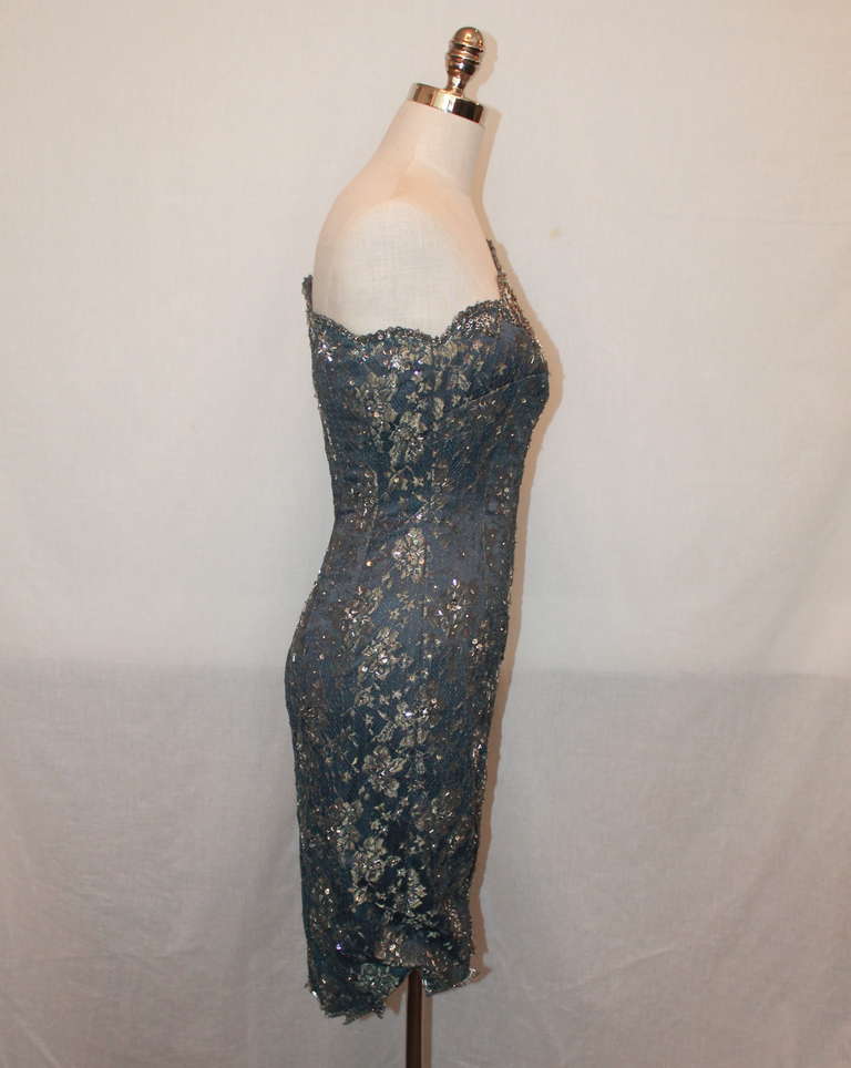 Mandalay grey & gold lace one-shouldered dress with sequin embellishment. Dress has special embellishing detail on the neckline and is in excellent condition. Size 6.
Measurements:
Bust- 30