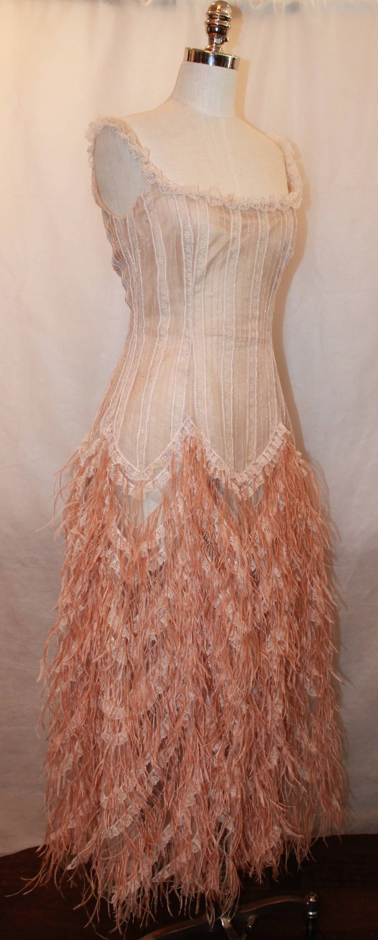 Oscar de la Renta Blush Lace Beaded Gown with Ostrich Feathers - M. This gown is in good condition with the only issue being on the bottom of the skirt (images 7-9). The bottom of the skirt has a rip on the side/back on the right side, but it is not