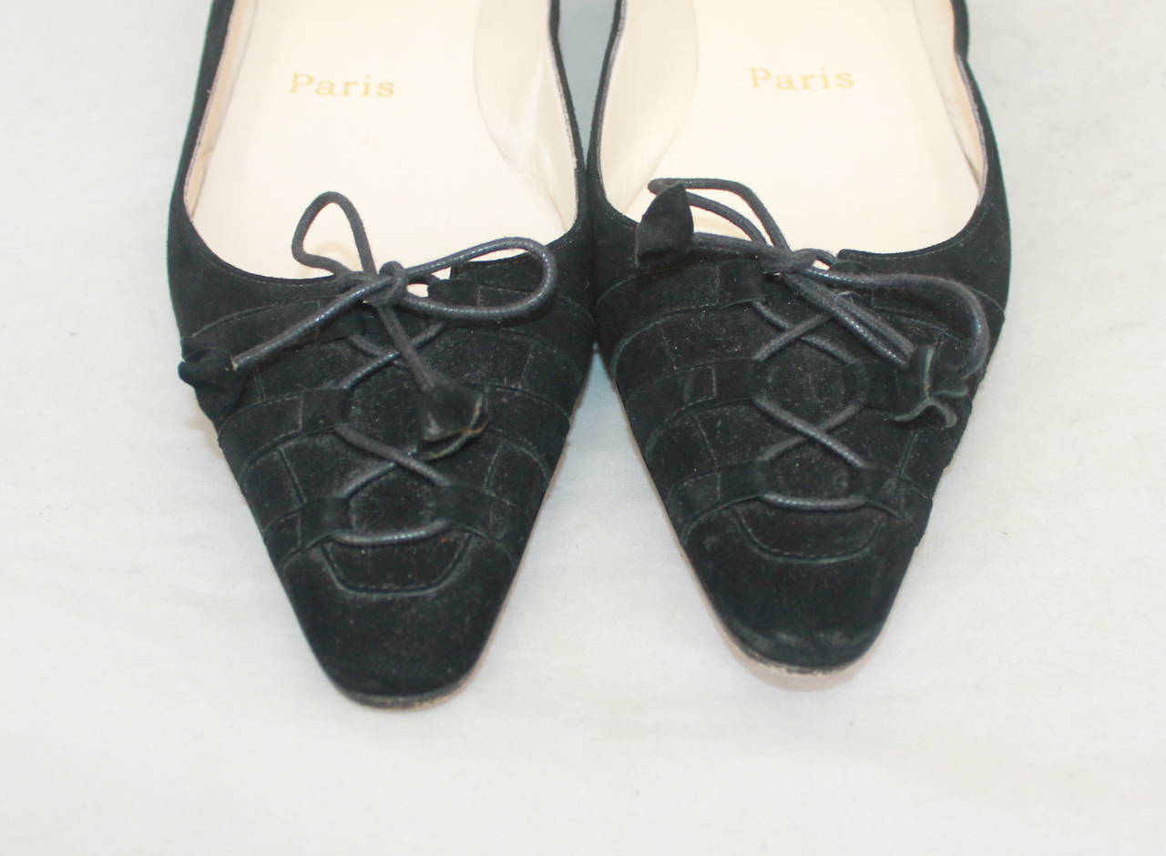 Christian Louboutin Black Suede Flats with Tie Up Front. These Size 37.5 Shoes are in Very Good Condition with Moderate Wear on the Bottom.