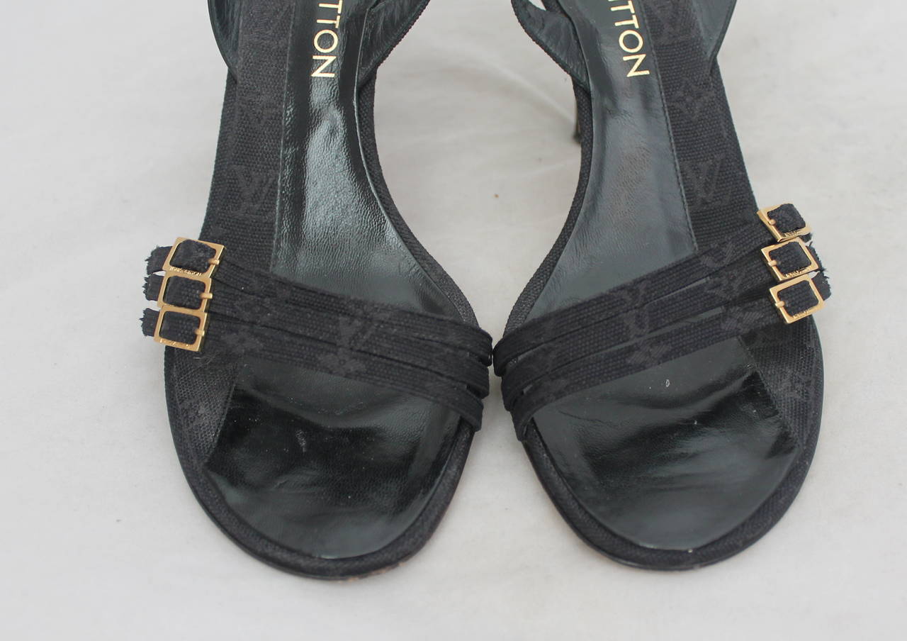 Louis Vuitton Black Printed Monogram Slingback Sandals with Three Small Buckles. These Size 38 Shoes are in Excellent Condition with Very Slight Wear on the Bottom.