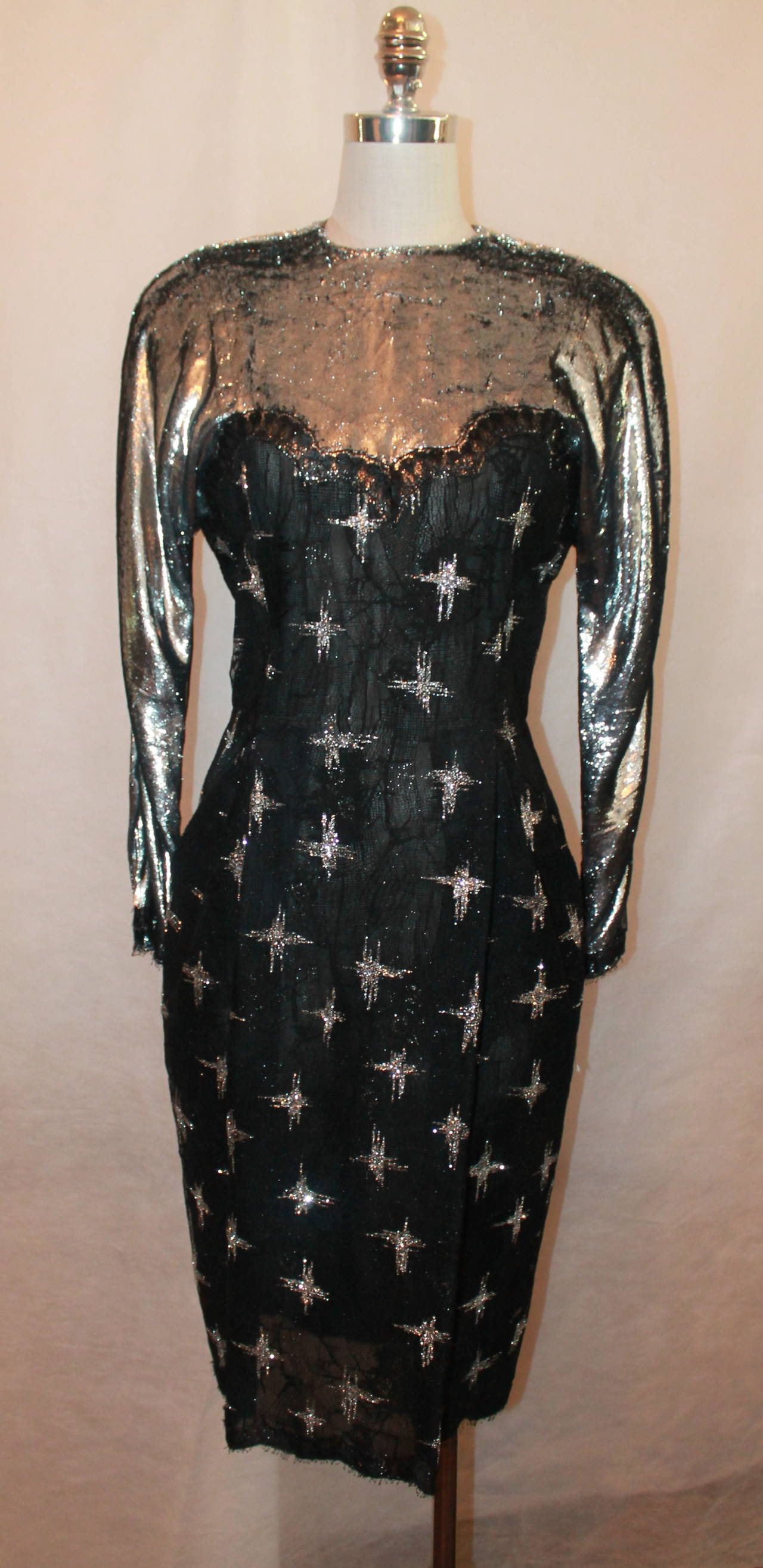 Geoffrey Beene 1980's Vintage Black & Silver Long Sleeve Dress - 8. This dress has a tinsel-like neckline, lace body with glitter star designs, and long sleeves. It is in very good vintage condition with minor pulls. 

Measurements:
Bust-