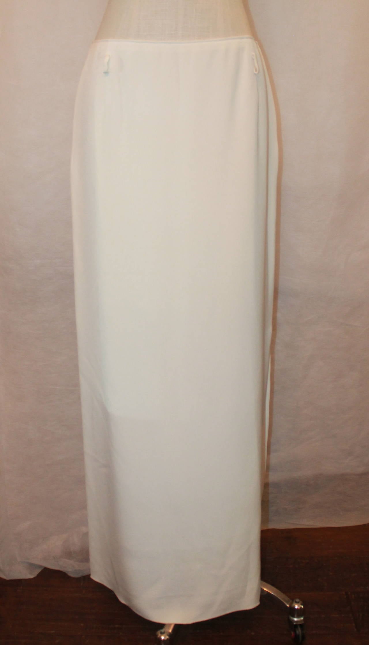 Oscar de la Renta 1990's Ivory Silk Long Skirt with Side Slit - 10. This skirt is in excellent condition and has holes at the waist for a thin belt. 

Measurements:
Waist- 31