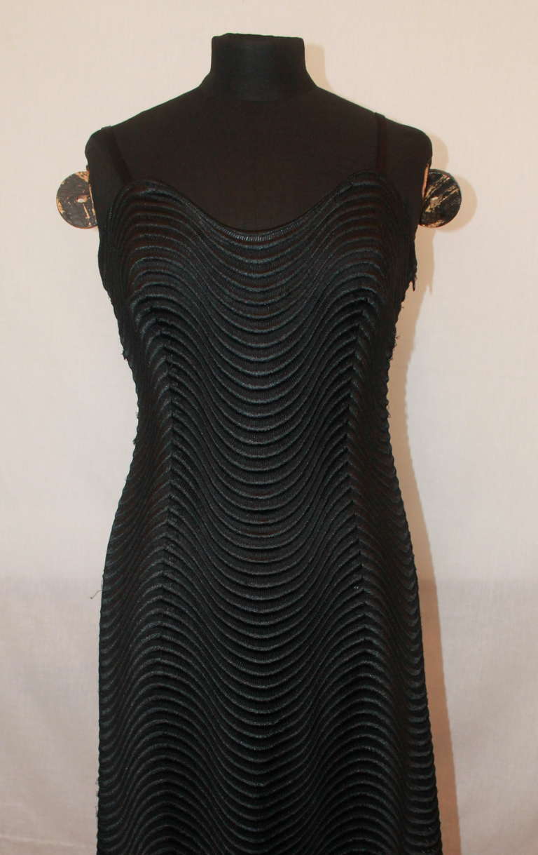 Escada Couture Black Spagetti Strap Crochet Gown. The crochet print is in a waved pattern. The gown is in excellent condition and a size 36.
Measurements:
Bust- 34.5