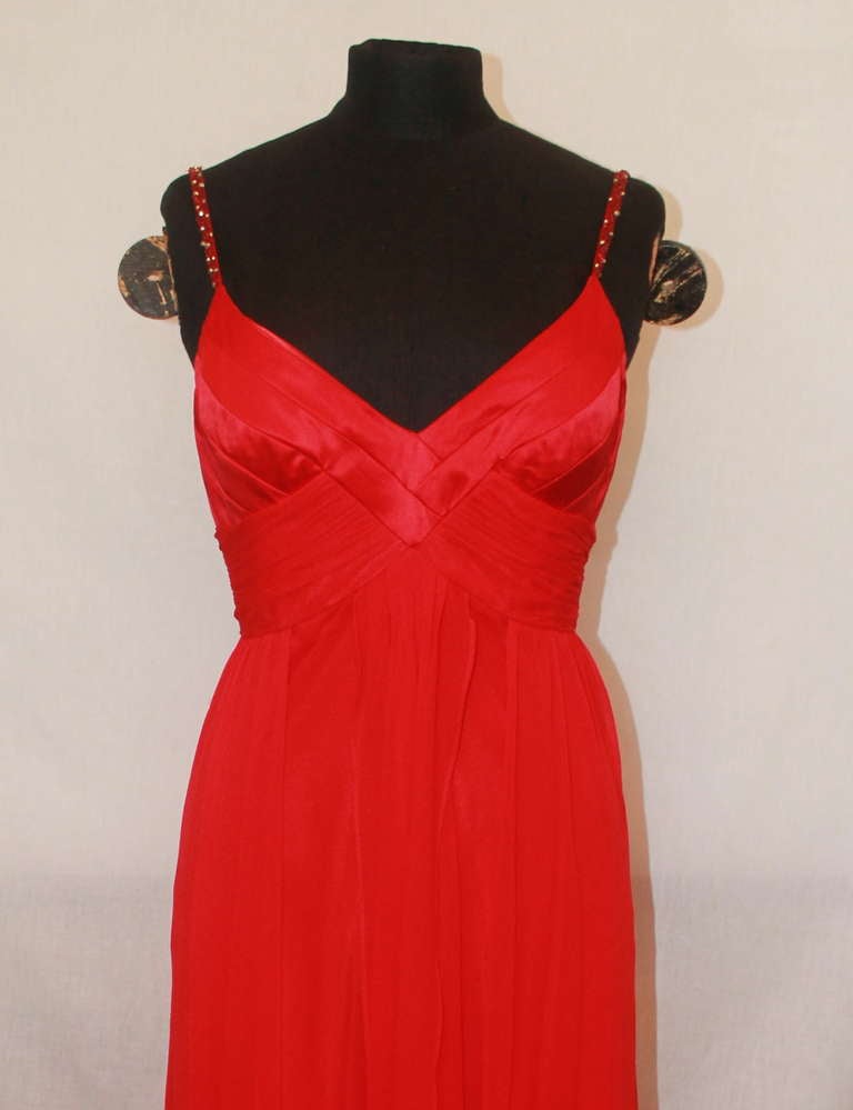 Mikael Aghal Red Silk Chiffon High-Low Gown. This gown has spaghetti straps with red & gold beading. The gown is in excellent condition and a size 8.
Measurements:
Bust- 33