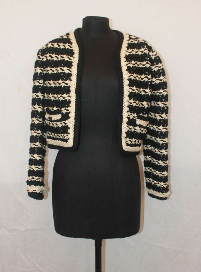Chanel Vintage Black & White Crochet Fabric Jacket. Circa 1980s. This jacket is in impeccable vintage condition with no visible pulls or wears. Size 40.
Measurements:
Shoulder to Shoulder- 15