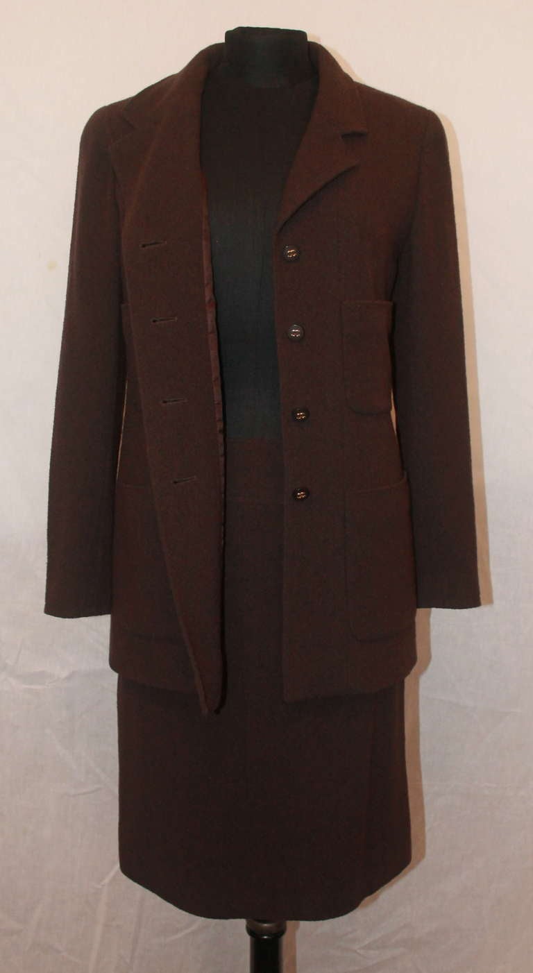 Chanel Chocolate Brown Wool Blend Skirt Suit. Jacket is single breasted with double pockets. The set is in impeccable condition and is from the 98A period. 
Measurements: Skirt & Jacket are size 36 and are from the 98A period. 
Bust-