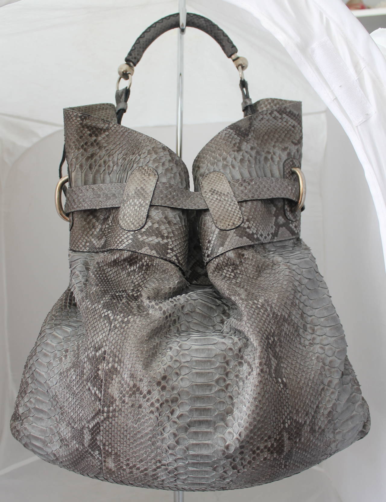 Burberry Grey Python Hobo-Style Large Tote . This bag is in excellent condition and has never been worn. It has a longer strap to crossbody and has a couple pockets in the front. The inside has 3 sections with the middle one being able to zip. It