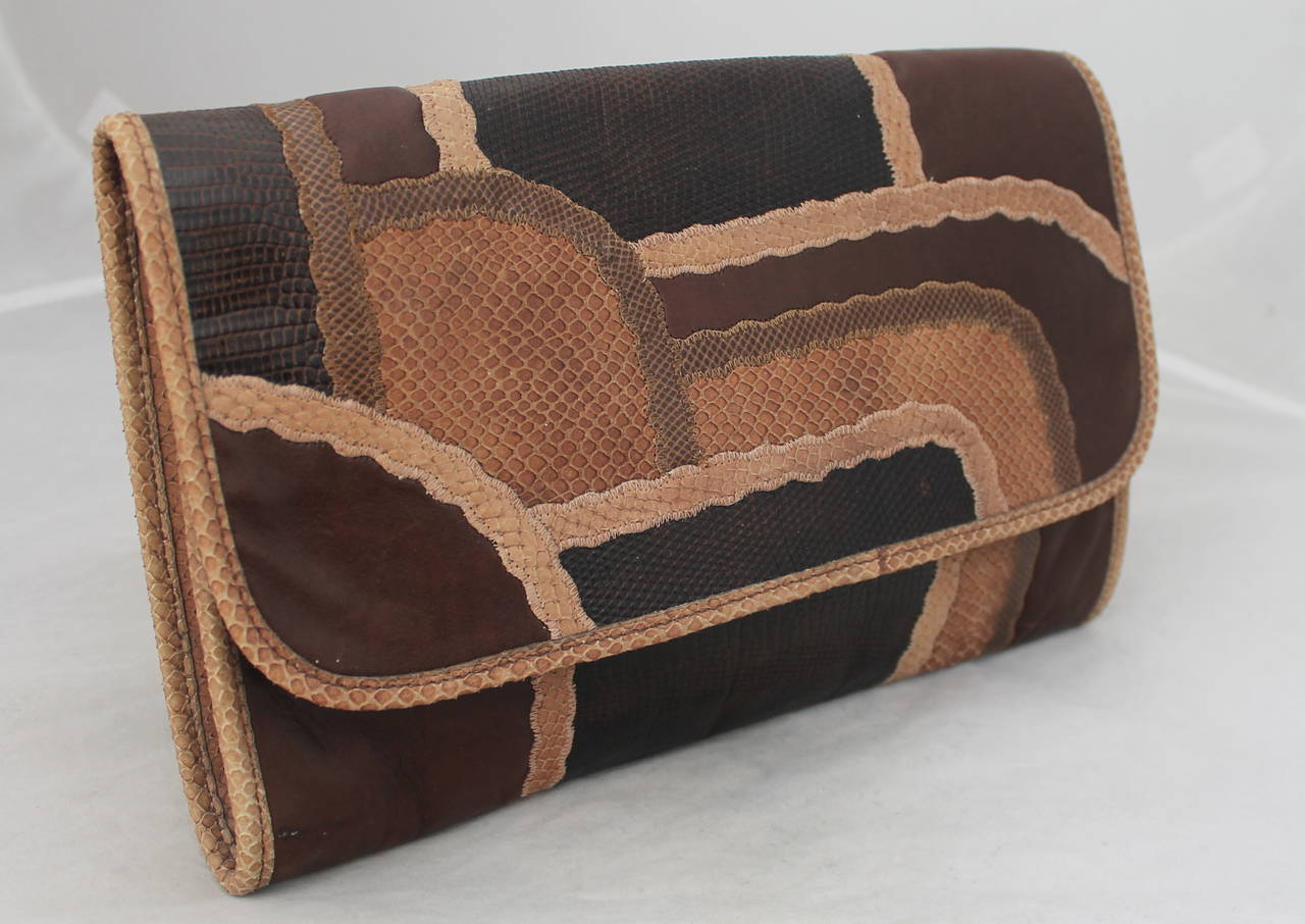 Carlos Falchi 1980's Vintage Brown Lizard, Snake & Leather Patchwork Crossbody. This bag is in excellent vintage condition with light wear consistent with age. The browns range from tan to brown and has a thin leather strap to crossbody.