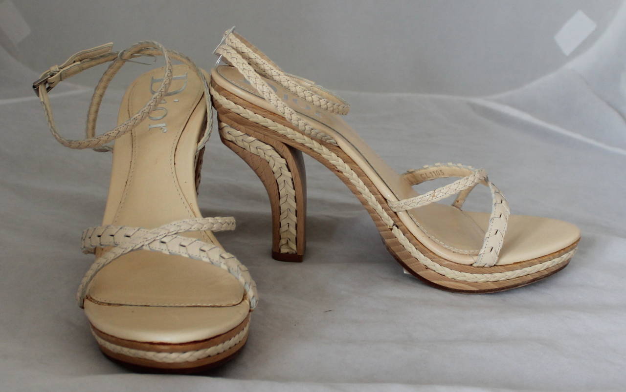 Christian Dior Creme Braided Leather Woodstack Heel - 38.5. These heels are in good condition with wear on the bottom and slight marks seen on the bottom of image 3 and image 6. Those markings are not visible when worn.