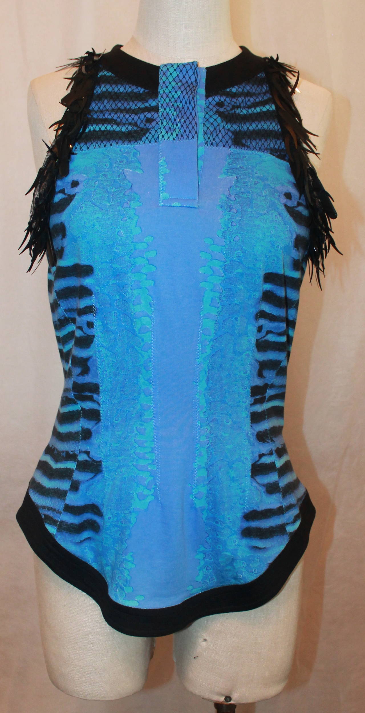 Roberto Cavalli Blue, Periwinkle, and Black Sleeveless Top with Black Outline along Hem, Arms, and Neck with Black Paillettes Around the Arms. 

Measurements:
Bust: 36 