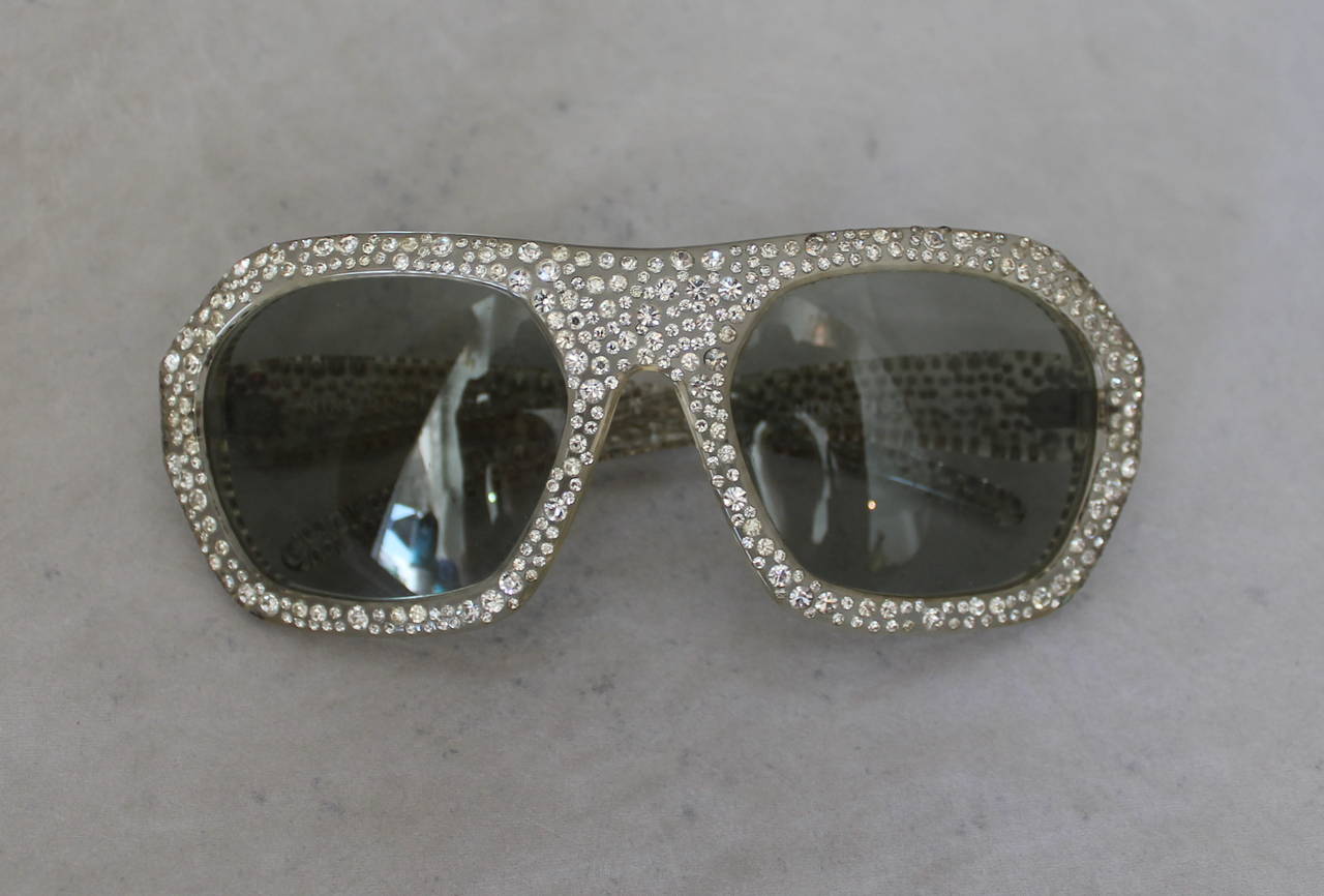 Nina Ricci 1970's Vintage Lucite & Rhinestone Sunglasses. These sunglasses are in excellent vintage condition and have minimal wear. The only areas where wear is noticeable are on a couple sections of rhinestones seen in images 6 & 7. 

Leg Length