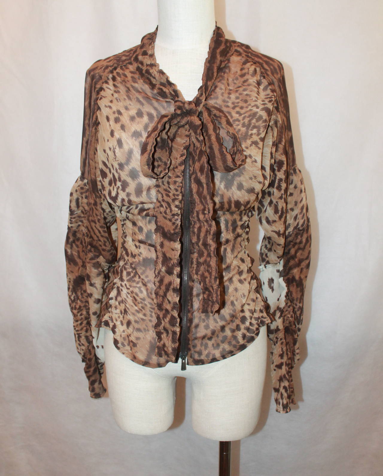 YSL Leopard Printed Sheer Blouse with Gatherings - S. This top is in excellent condition and has a long zipper as closure. The neckline is ruched and there are gatherings on the sleeves & sides. It also has a necktie. 

Measurements:
Bust-