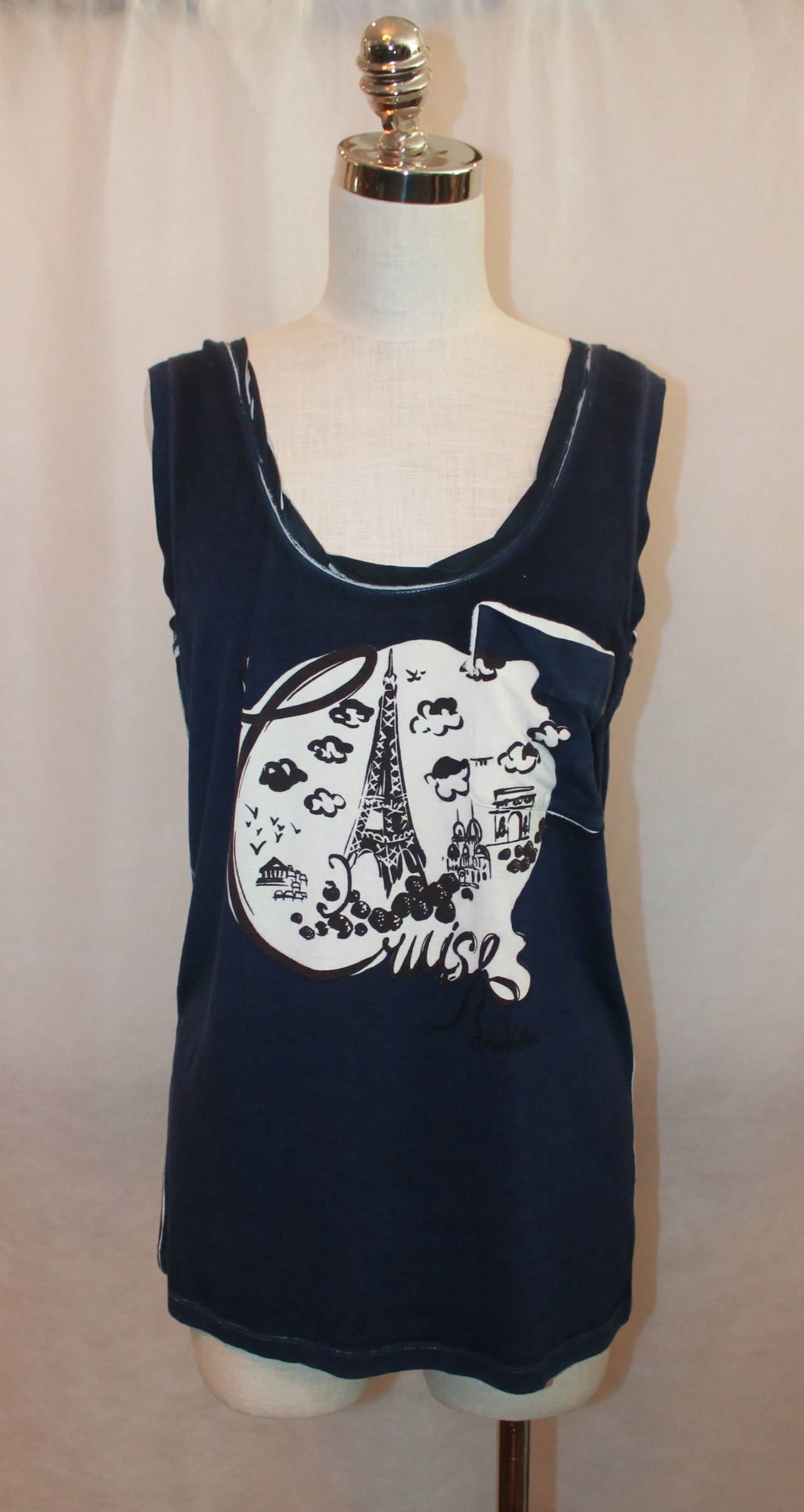 Louis Vuitton 2012 Resort Navy Paris Motif Tank with Pocket - M. This tank is in good condition with light wear. It is 88% viscose and 12% silk. It has a loose fit and has Parisian icons on it with a 