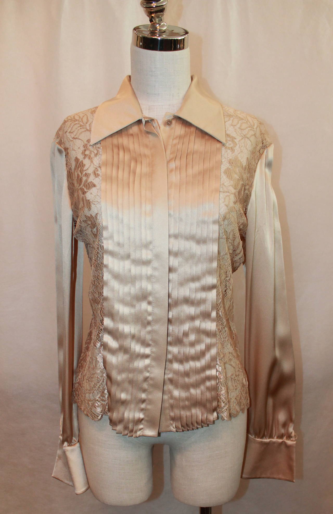 Valentino Beige Silk and Lace Long Sleeve Shirt with Front Pleating and Lace Bodice. This Size 10 Shirt is in Excellent Condition and is New With Tags. It Retails at $2275.00, as Seen on the Tags Pictured.

Measurements:
Bust: 38 