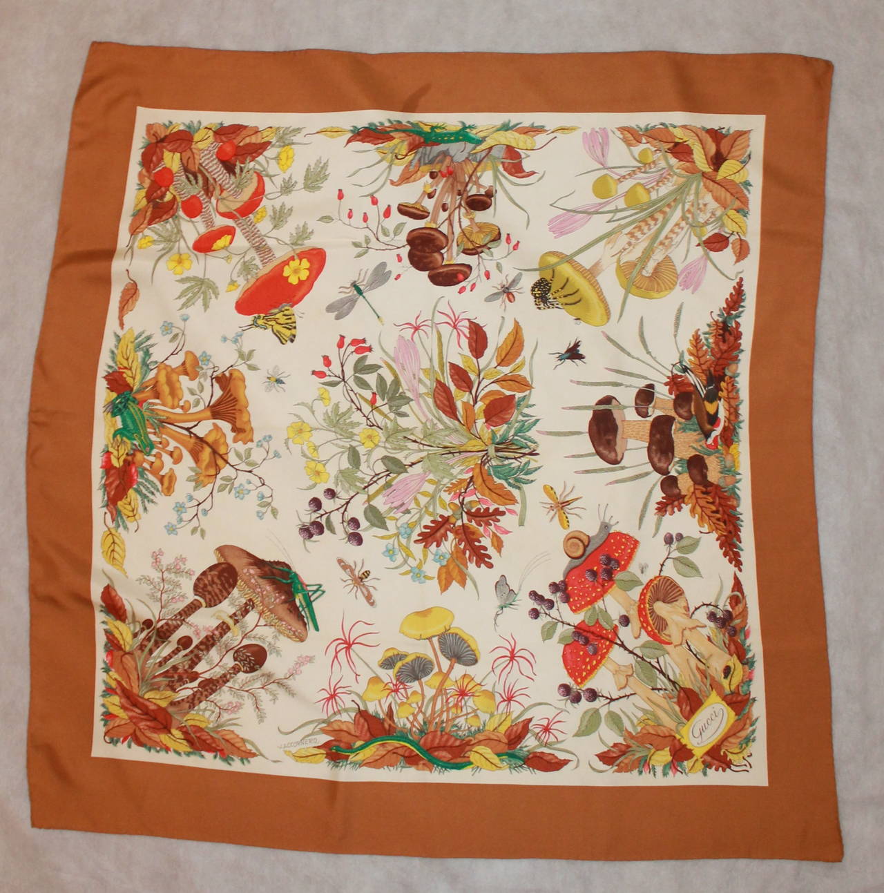 Vittorio Accornero for Gucci Forest Plant Printed Silk Scarf with Camel Trim Scarf. This scarf is in excellent condition. 

Length- 34.75