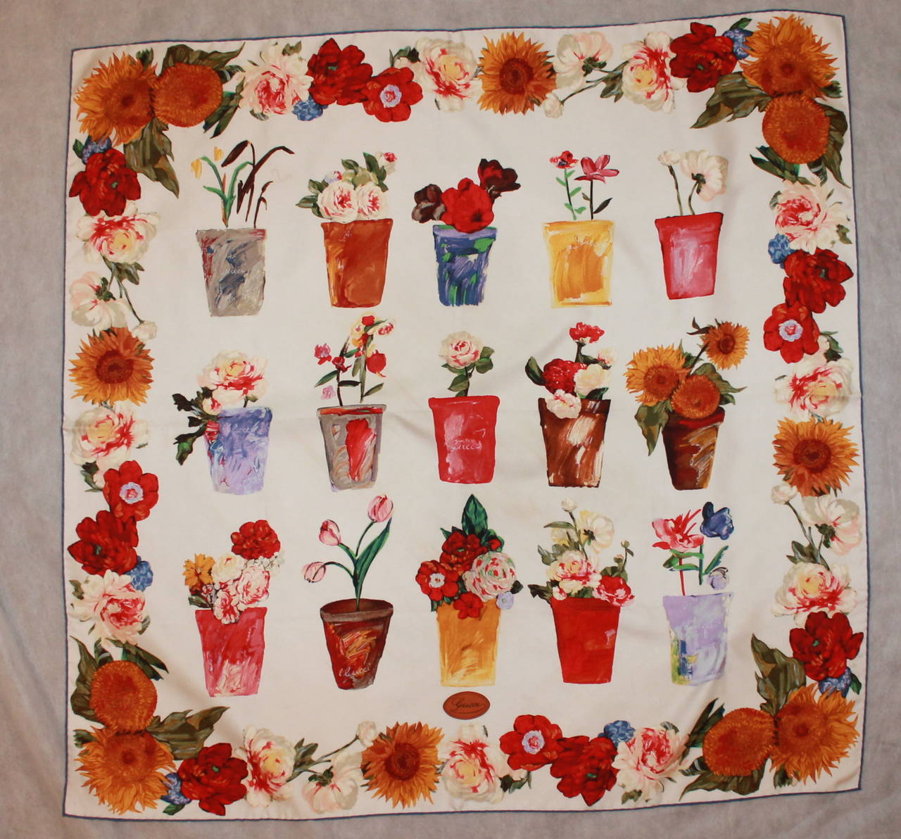 Gucci Silk Multi-Color Flower Pot Printed Scarf. This scarf is in good condition with very minor markings shown in images 4 & 5. 

Length- 34.5