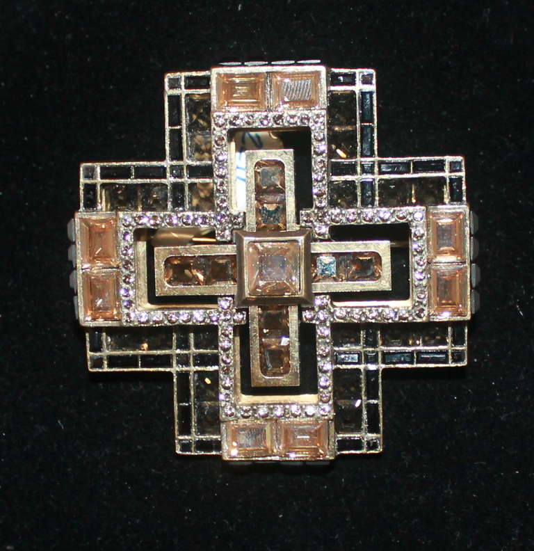Lanvin Citrine Cross Pin. The stones are a mixture of lighter & deep shades. The pin also has a loop to make a necklace accessible. Retail price is $1700.00.
Measurements:
Length- 2.5