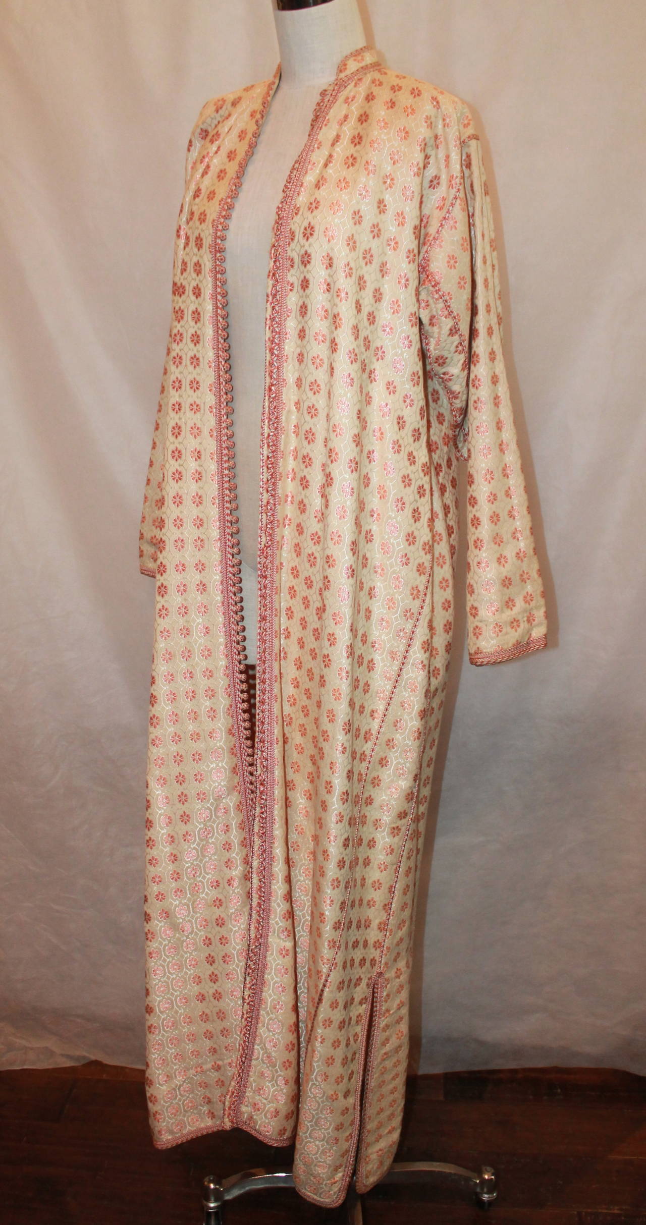 1960's Vintage Creme & Coral Silk Brocade Asian Coat. This coat is in good vintage condition with most of the wear being out of sight on the inside lining. There are stains on the lining seen on images 6-9. The only prominent wear visible on the